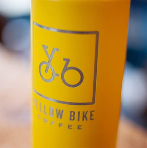 Yellow Bike Coffee mug with logo