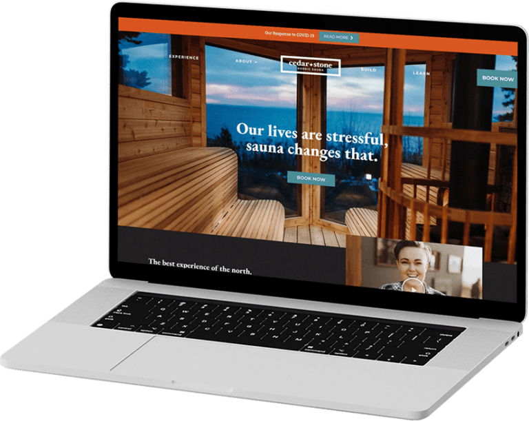 A laptop with Cedar and Stone Nordic Sauna website