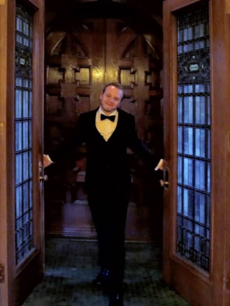 Man in a suit at the Glensheen Mansion