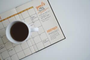 Cup of coffee sitting on a calendar